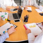 high-angle-corporate-desk-with-electronic-devices